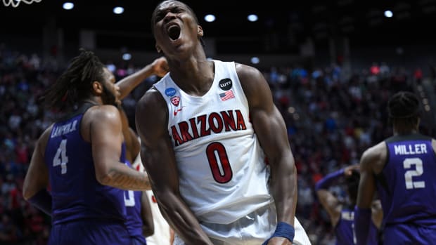 Mar 20, 2022; San Diego, CA, USA; Arizona Wildcats guard Bennedict Mathurin (0) reacts after scoring in the overtime period against the TCU Horned Frogs during the second round of the 2022 NCAA Tournament at Viejas Arena. Mandatory Credit: Orlando Ramirez-USA TODAY Sports